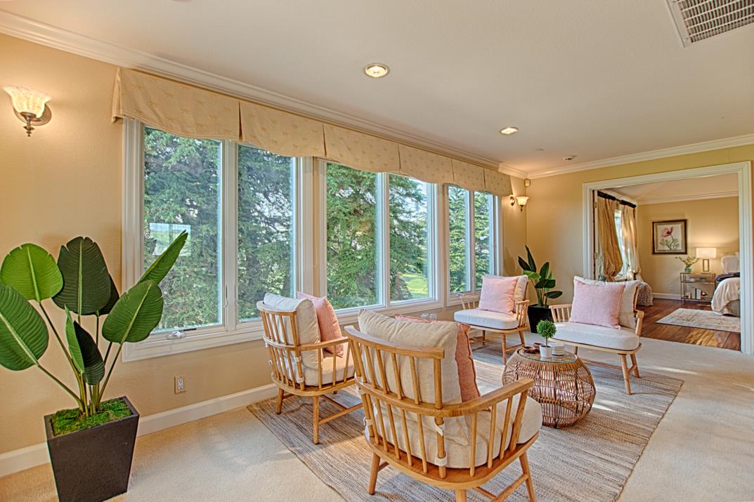 2140 Winged Foot Road Half Moon Bay, CA 94019 - Photo 25 of 52 a living room with furniture and a potted plant