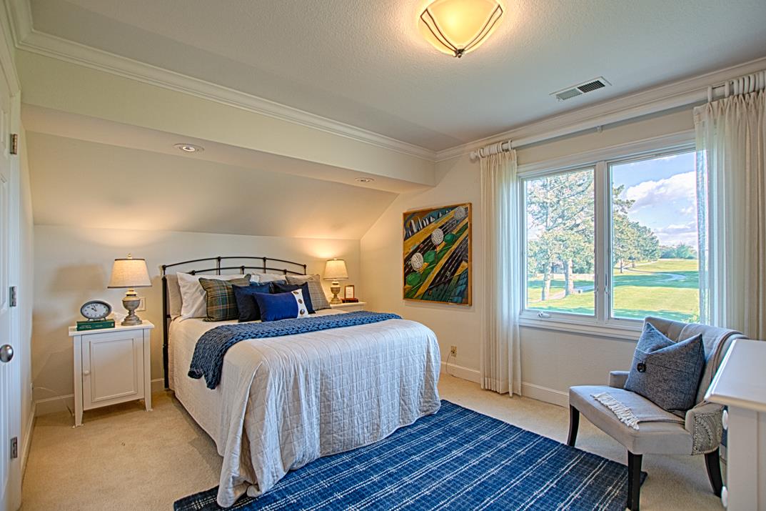 2140 Winged Foot Road Half Moon Bay, CA 94019 - Photo 29 of 52 a bedroom with two beds and a chair