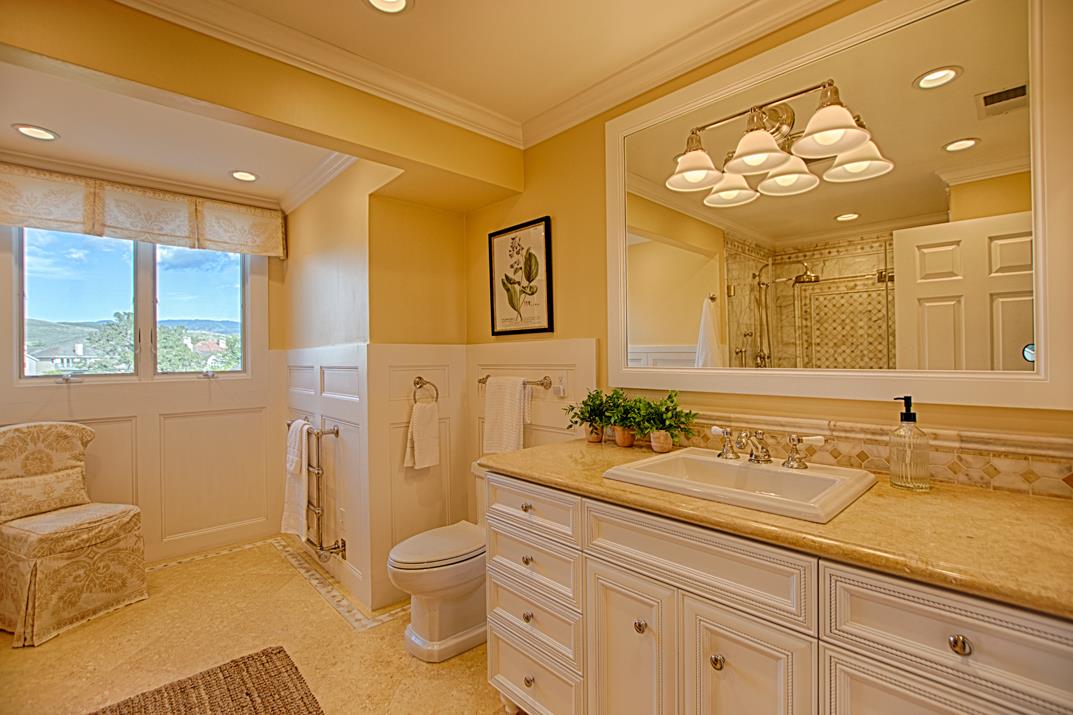 2140 Winged Foot Road Half Moon Bay, CA 94019 - Photo 31 of 52 a bathroom with a granite countertop sink mirror vanity and toilet