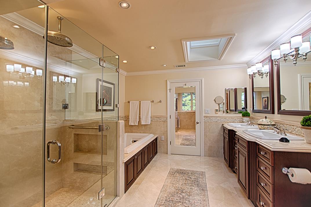 2140 Winged Foot Road Half Moon Bay, CA 94019 - Photo 35 of 52 a bathroom with a tub sink shower and mirror