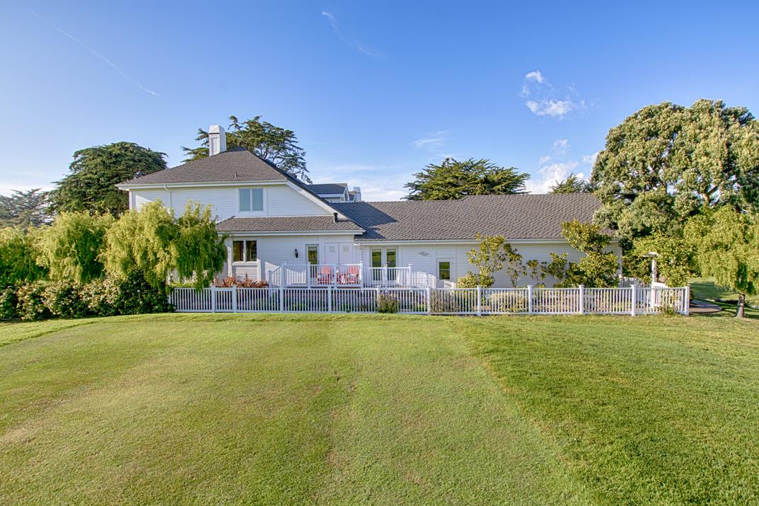 2140 Winged Foot Road Half Moon Bay, CA 94019 - Photo 37 of 52 a front view of house with yard and trees