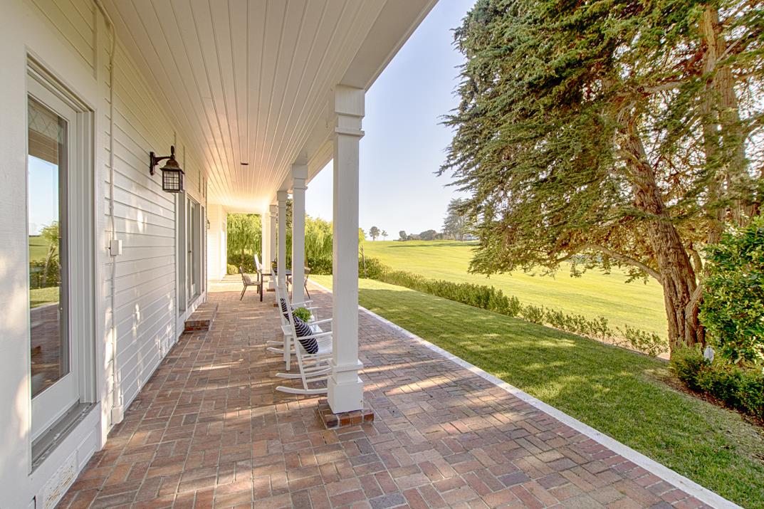 2140 Winged Foot Road Half Moon Bay, CA 94019 - Photo 41 of 52 a view of a patio with a table chairs and garden