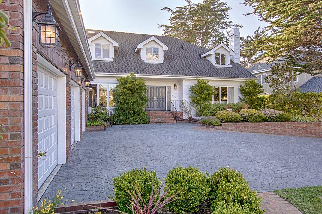 2140 Winged Foot Road Half Moon Bay, CA 94019 - Photo 51 of 52 a view of a brick house with a yard plants and large tree