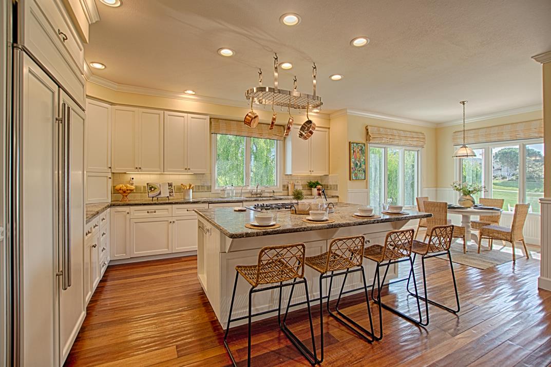 2140 Winged Foot Road Half Moon Bay, CA 94019 - Photo 10 of 52 a kitchen with a table chairs stove and cabinets
