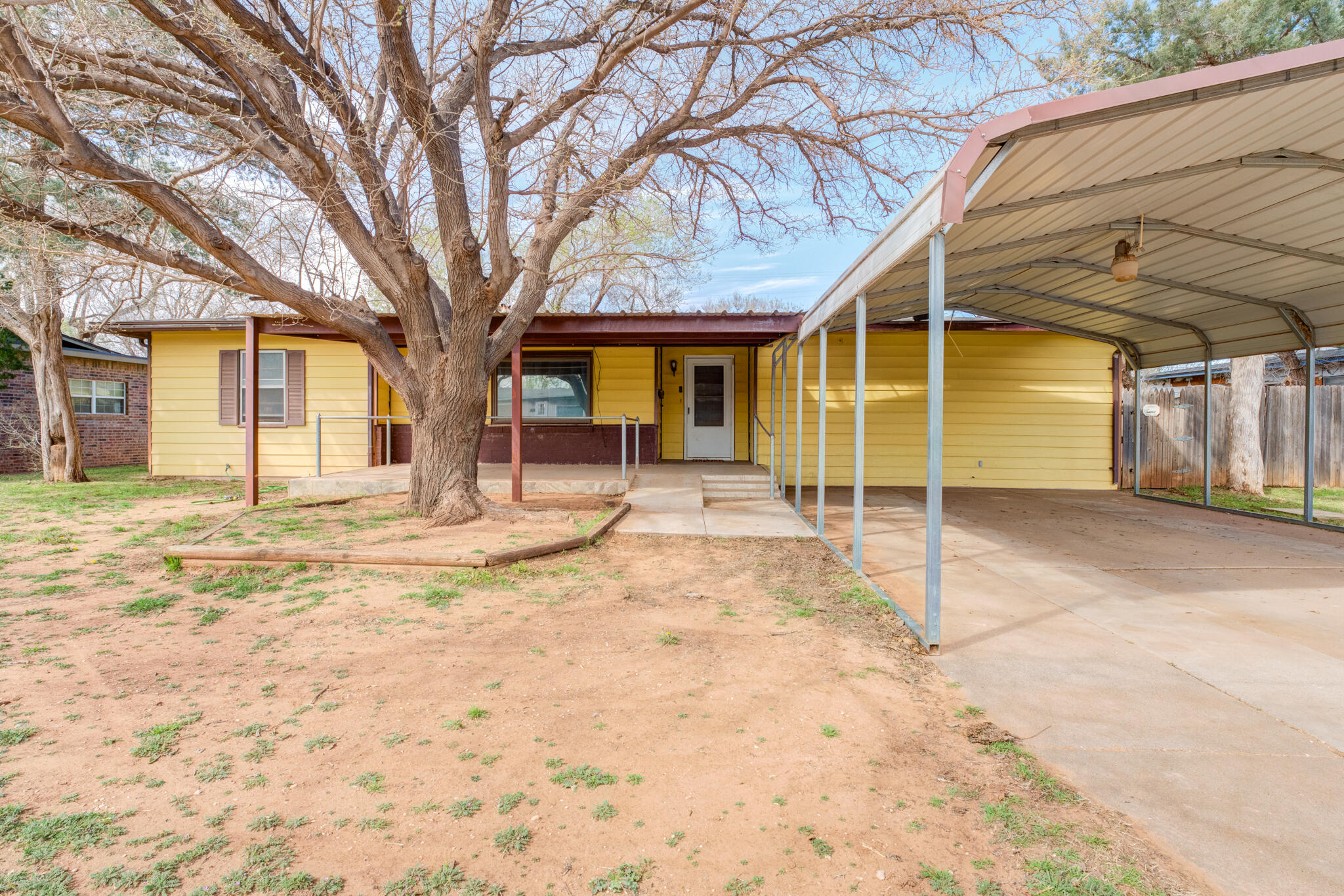 4612 Canton Avenue Lubbock, TX 79413 - Photo 1 of 15 a view of a house with a snow in the yard