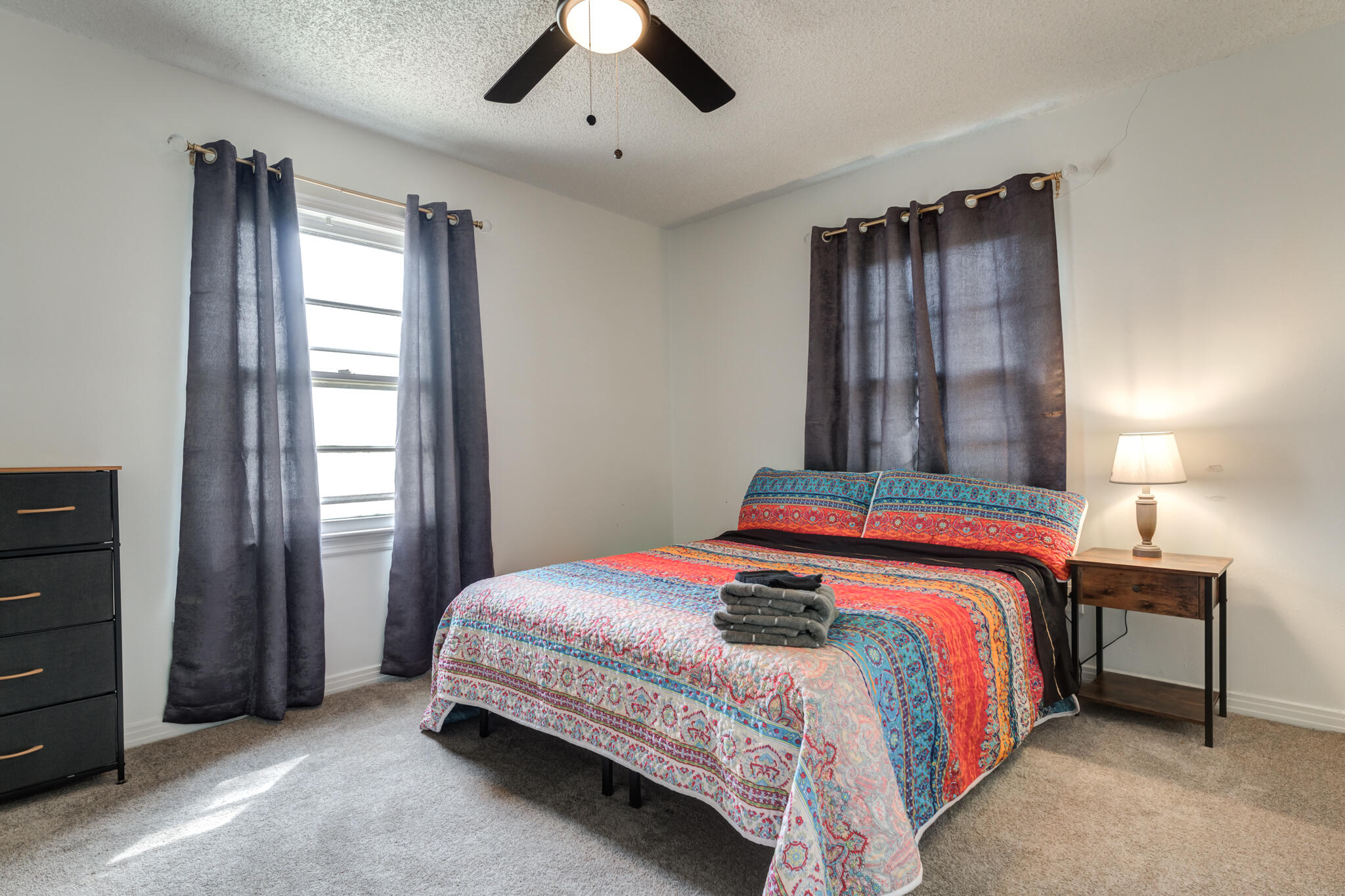 4612 Canton Avenue Lubbock, TX 79413 - Photo 14 of 15 a bedroom with a bed and a window