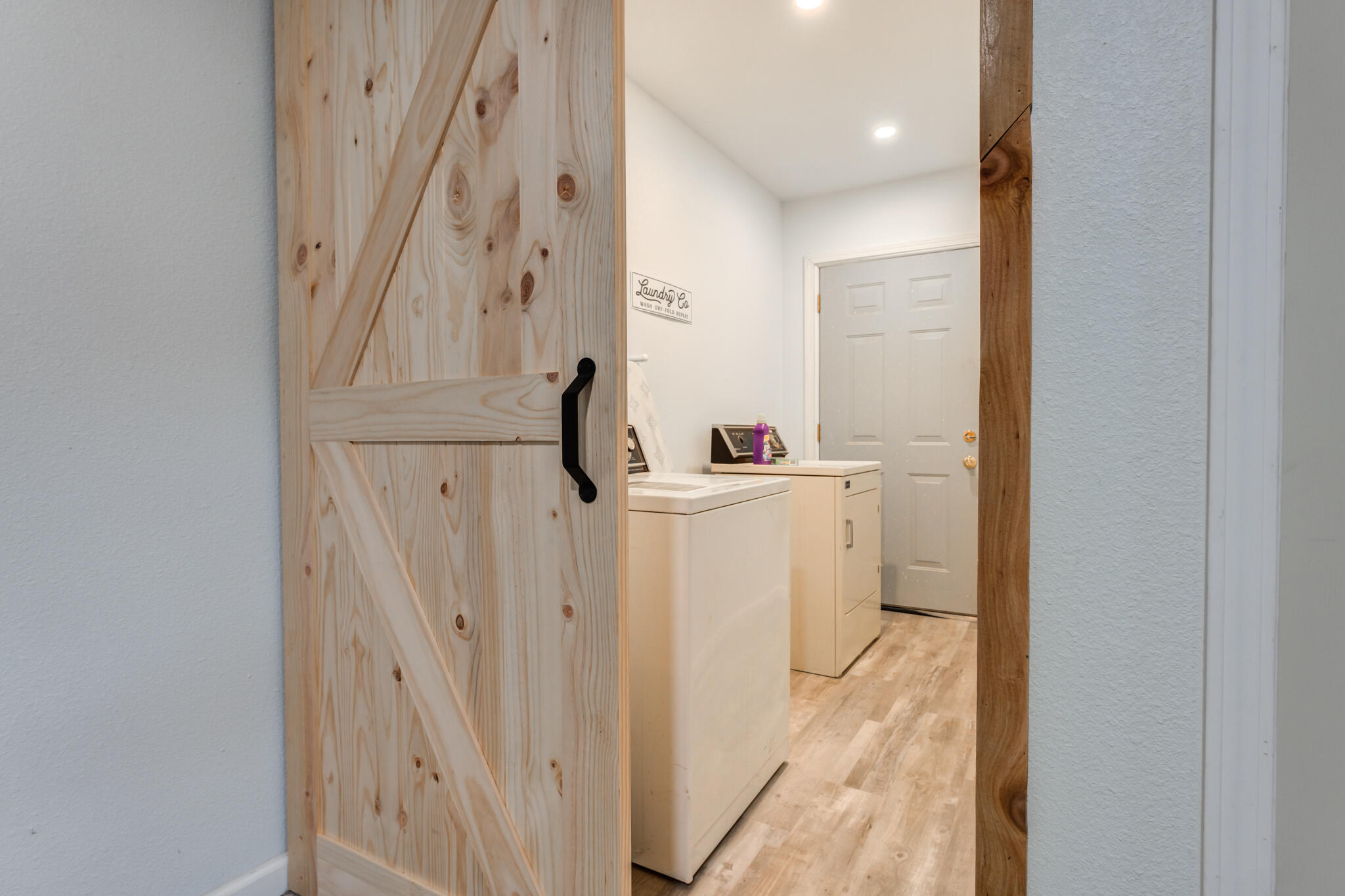 4612 Canton Avenue Lubbock, TX 79413 - Photo 6 of 15 a bathroom with a sink a toilet a mirror and shower