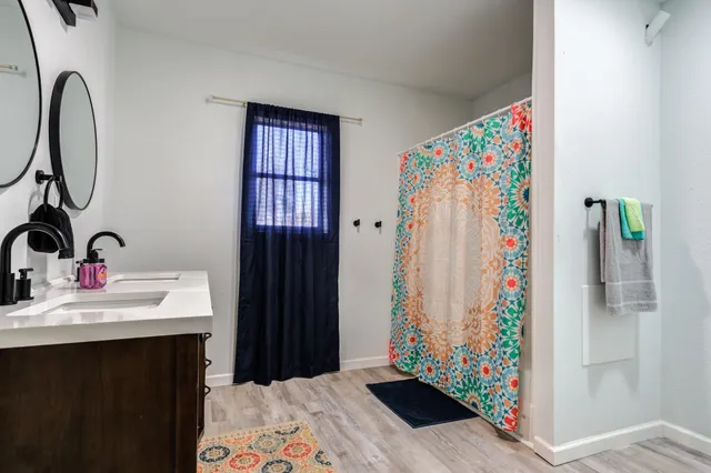 a bathroom with a sink and a mirror