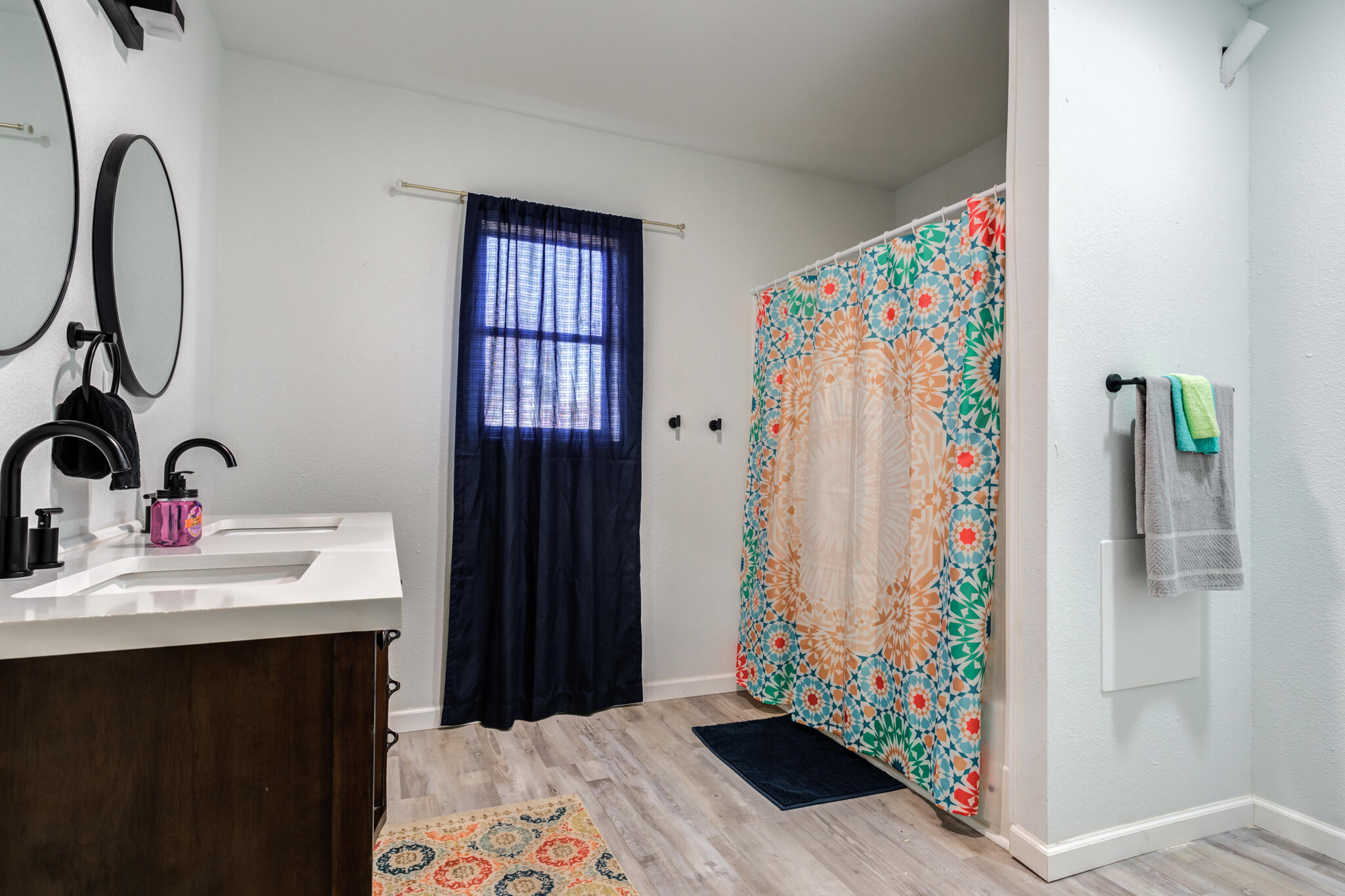 4612 Canton Avenue Lubbock, TX 79413 - Photo 9 of 15 a bathroom with a sink and a mirror