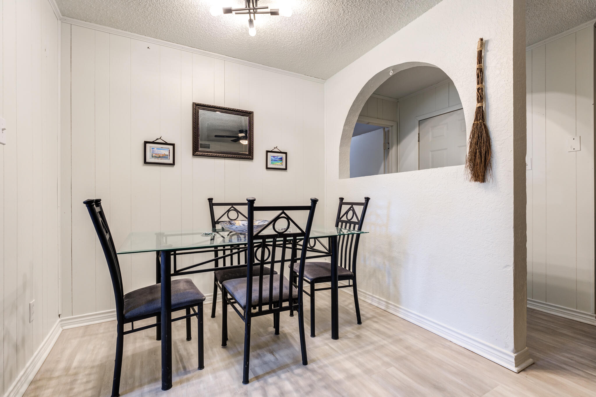 4612 Canton Avenue Lubbock, TX 79413 - Photo 10 of 15 a view of a dining room with furniture and wooden floor