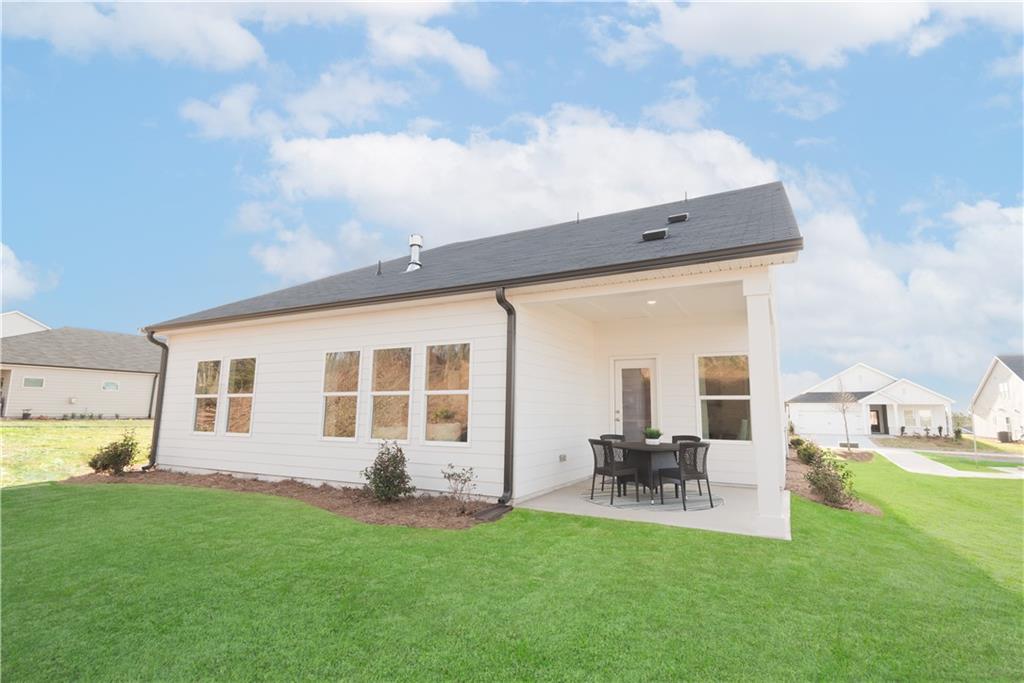 3940 Ladiga Street Powder Springs, GA 30127 - Photo 17 of 31 a patio with table and chairs and potted plants