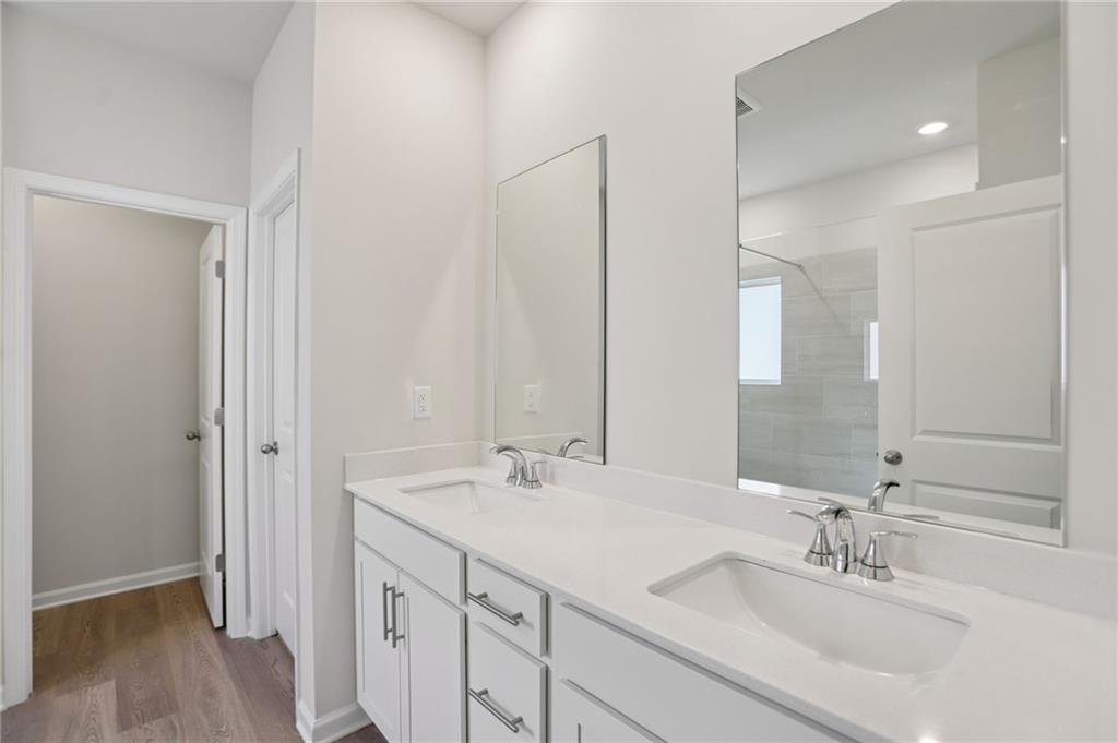 3940 Ladiga Street Powder Springs, GA 30127 - Photo 20 of 31 a bathroom with a sink and a mirror