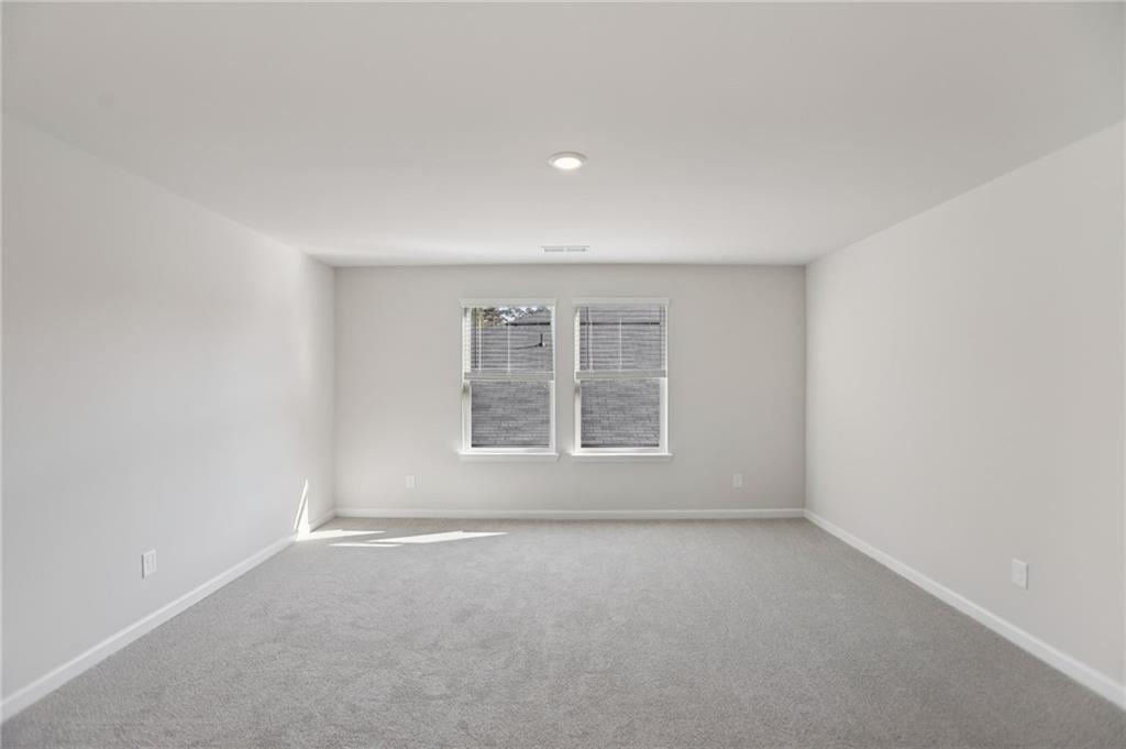 3940 Ladiga Street Powder Springs, GA 30127 - Photo 23 of 31 an empty room with a window