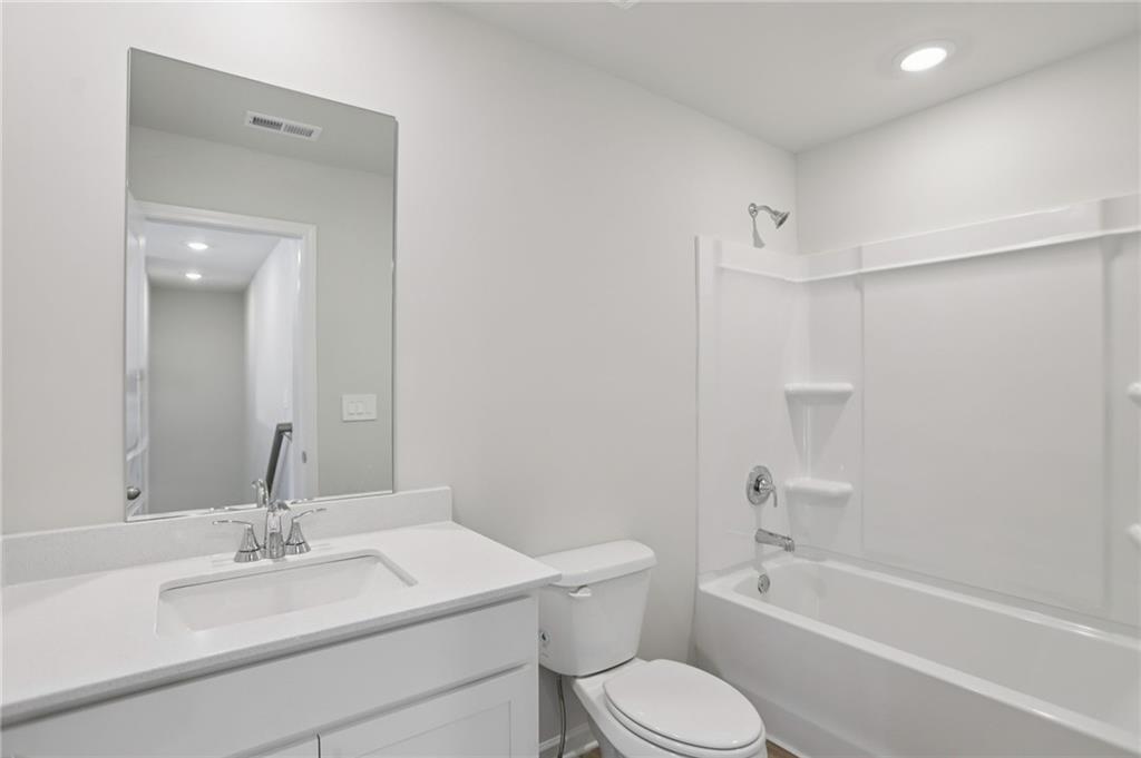 3940 Ladiga Street Powder Springs, GA 30127 - Photo 27 of 31 a bathroom with a sink toilet and shower
