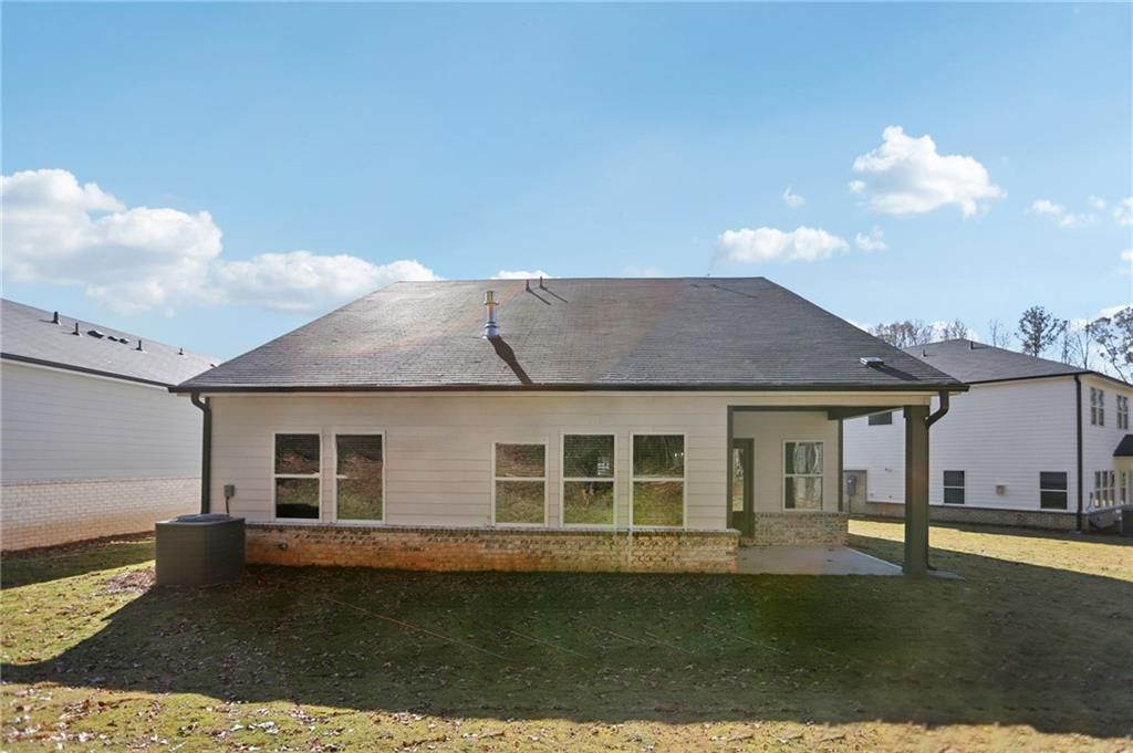 3940 Ladiga Street Powder Springs, GA 30127 - Photo 29 of 31 a front view of a house with a garden