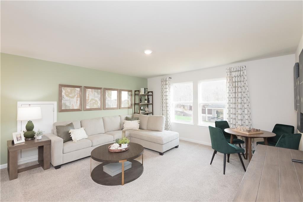 3940 Ladiga Street Powder Springs, GA 30127 - Photo 6 of 31 a living room with furniture and a large window