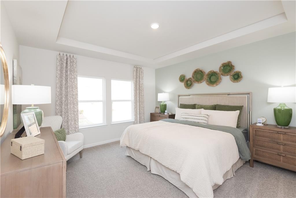 3940 Ladiga Street Powder Springs, GA 30127 - Photo 8 of 31 a bedroom with a bed and window