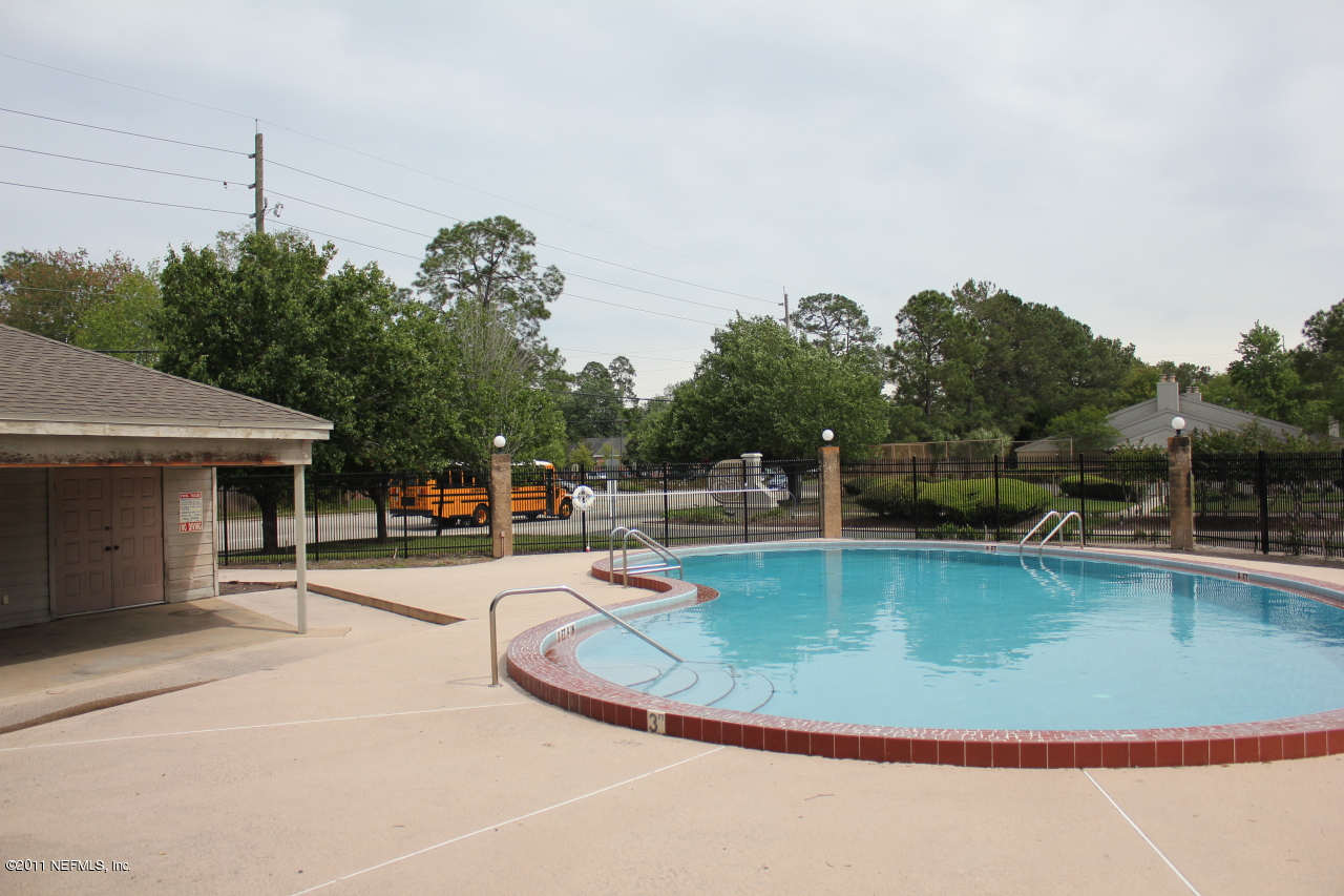 3801 Crown Point Road, Unit 2131 Jacksonville, FL 32257 - Photo 3 of 5 a view of a swimming pool with a patio