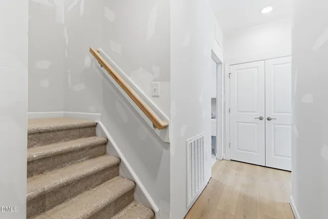 a bathroom with a granite countertop sink mirror and vanity