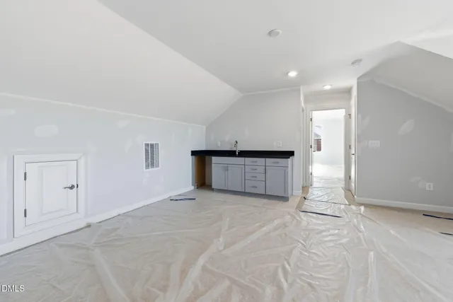 a bathroom with a sink toilet vanity and shower