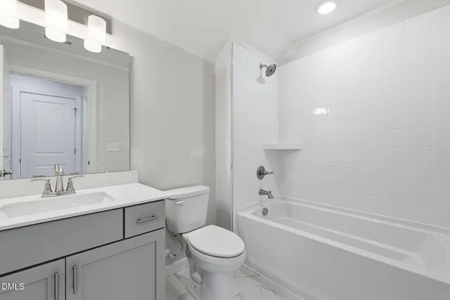 a view of a house with a wooden fence