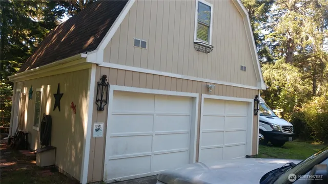 a view of front door and small yard