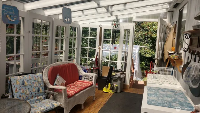 a view of a workspace with furniture and entryway