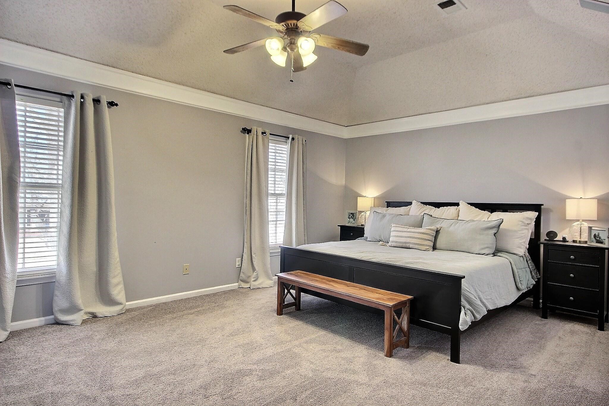 556 Rillbrook Drive Collierville, TN 38017 - Photo 11 of 22 a bedroom with a bed and a ceiling fan