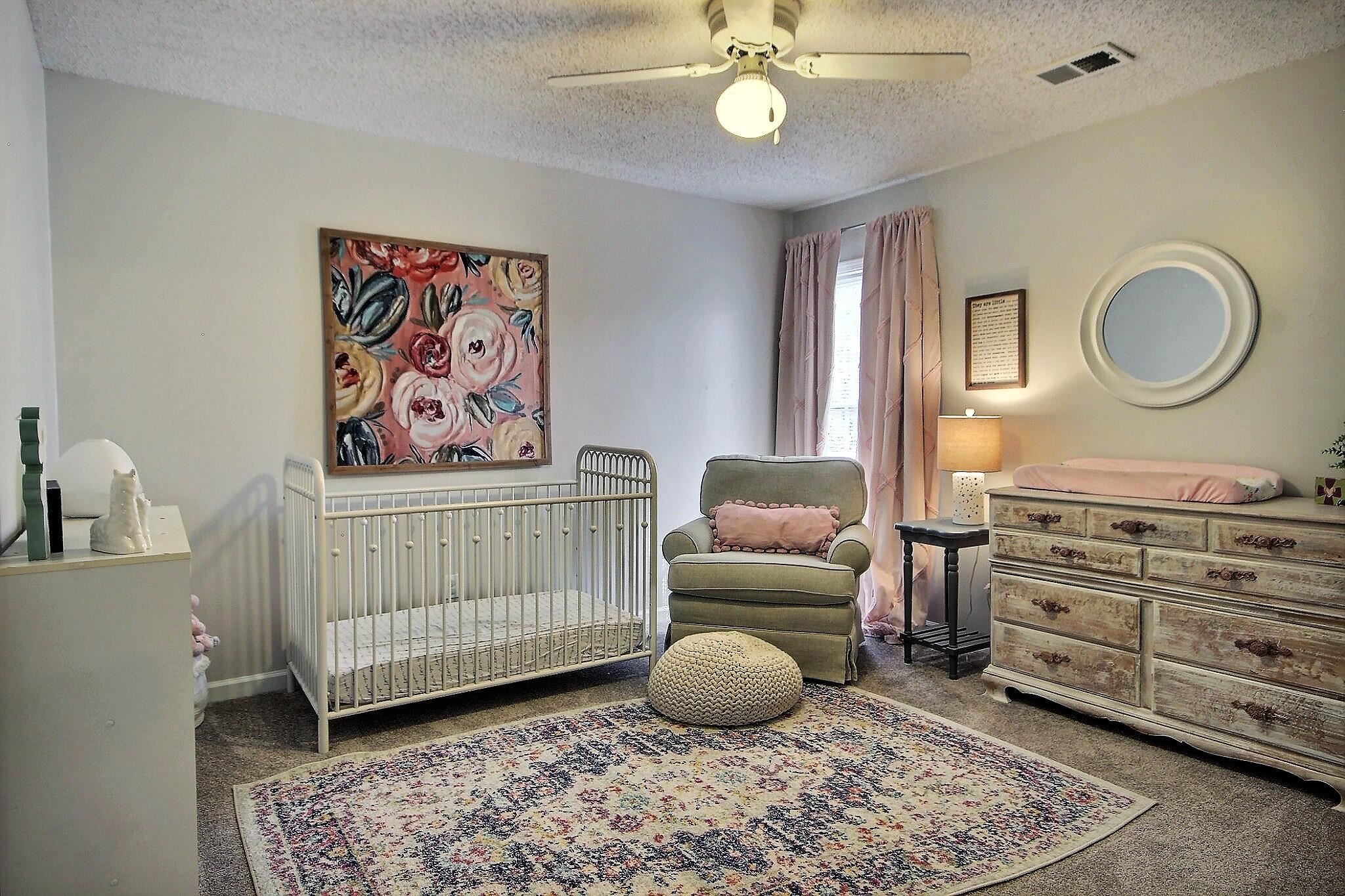 556 Rillbrook Drive Collierville, TN 38017 - Photo 16 of 22 a bedroom with a baby bed a couch and dresser