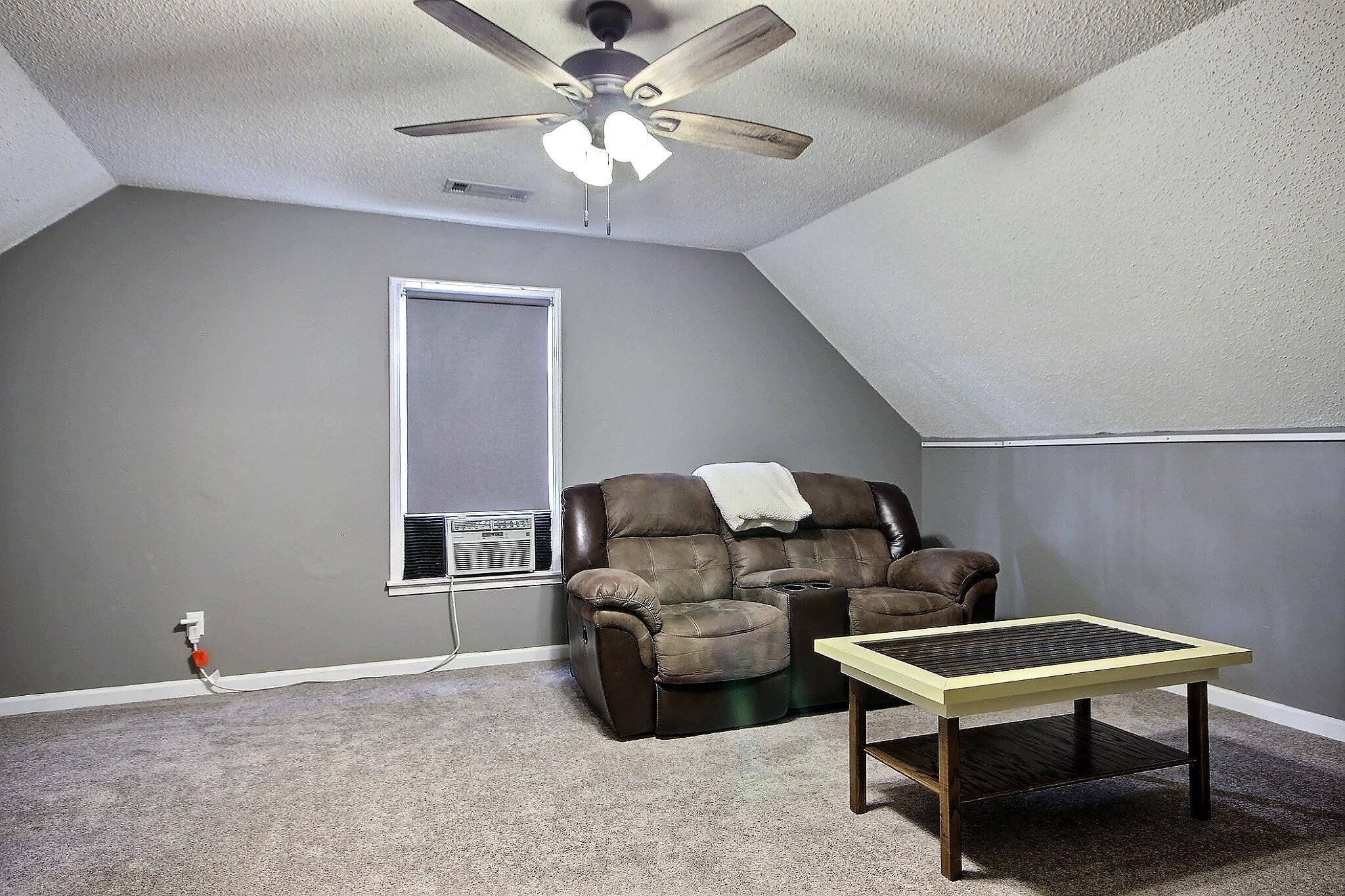 556 Rillbrook Drive Collierville, TN 38017 - Photo 18 of 22 a living room with furniture a ceiling fan and a window