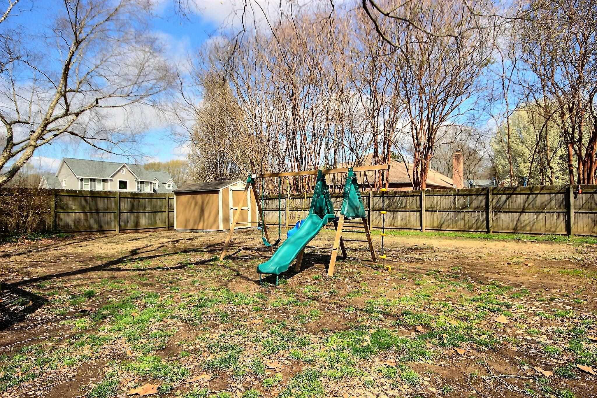 556 Rillbrook Drive Collierville, TN 38017 - Photo 20 of 22 a view of outdoor space with playground and tree