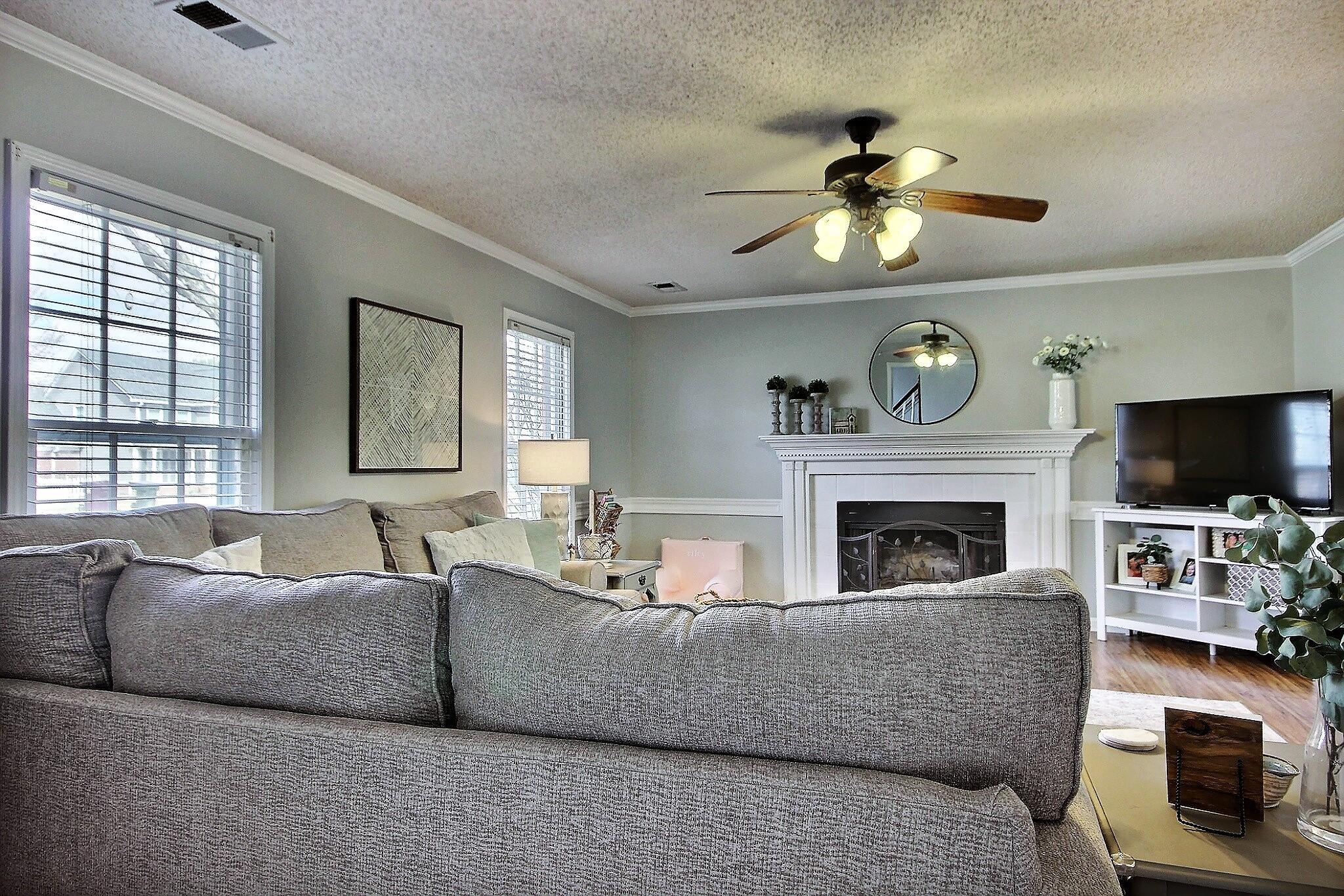 556 Rillbrook Drive Collierville, TN 38017 - Photo 3 of 22 a living room with furniture a flat screen tv and a fireplace