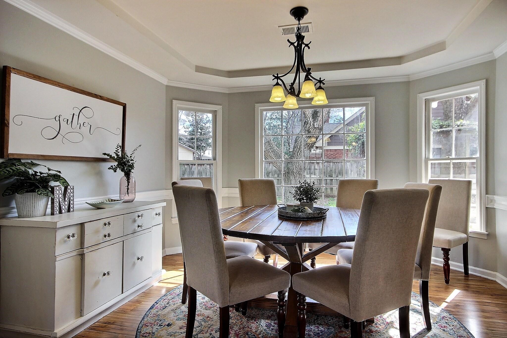 556 Rillbrook Drive Collierville, TN 38017 - Photo 4 of 22 a dining room with furniture a chandelier and window