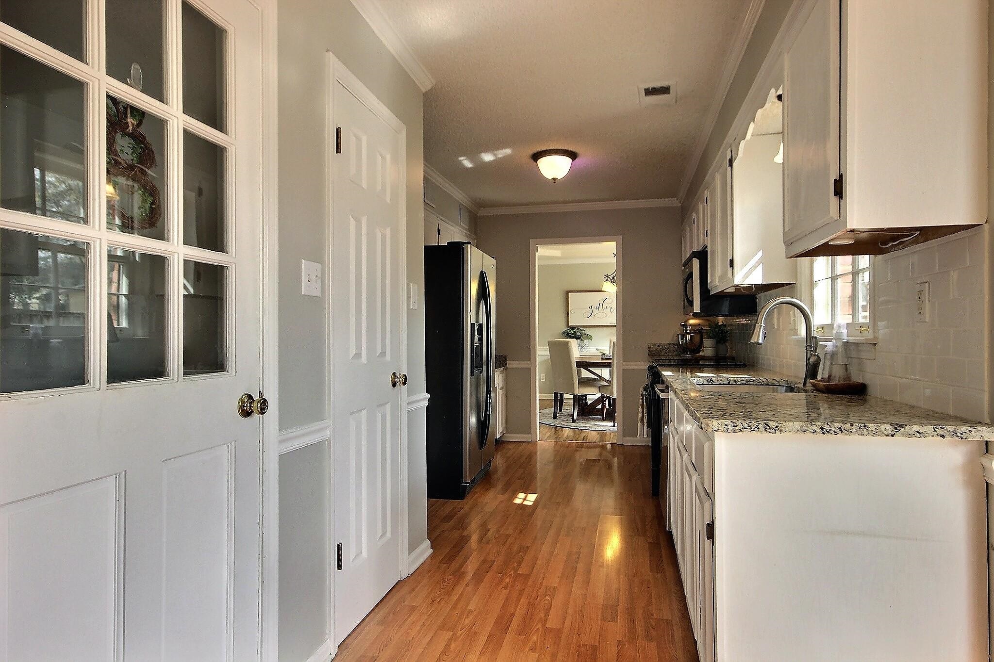556 Rillbrook Drive Collierville, TN 38017 - Photo 6 of 22 a kitchen with counter top space and wooden floor