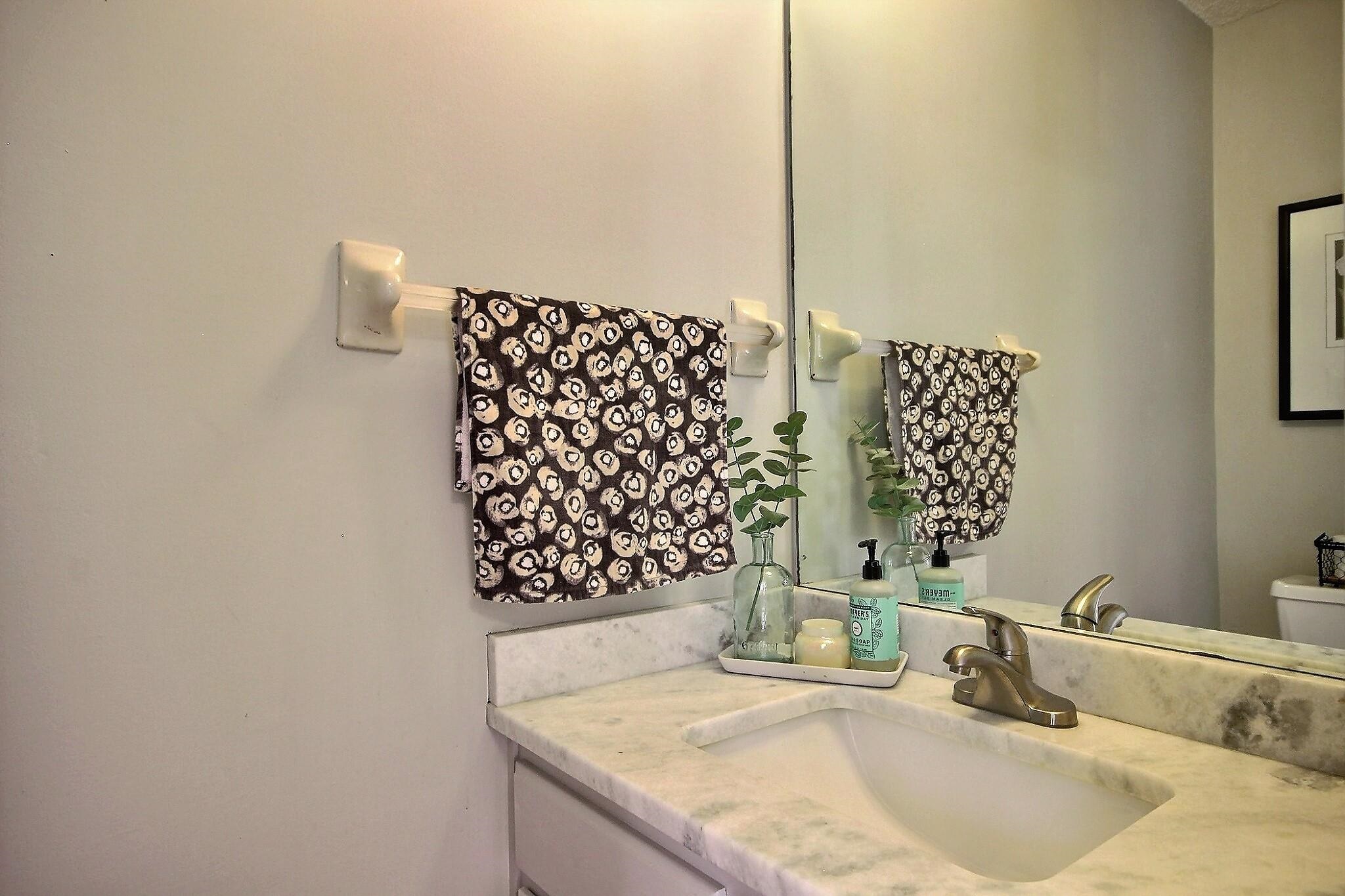 556 Rillbrook Drive Collierville, TN 38017 - Photo 9 of 22 a bathroom with a granite countertop sink a vanity and shower