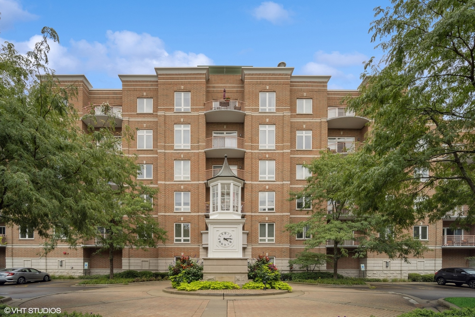 799 Graceland Avenue, Unit 502A Des Plaines, IL 60016 - Photo 1 of 31 a front view of a residential apartment building with a yard