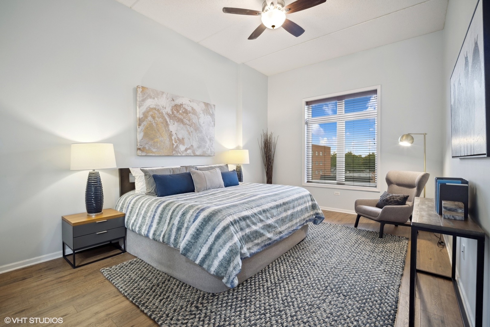 799 Graceland Avenue, Unit 502A Des Plaines, IL 60016 - Photo 21 of 31 a bedroom with a bed a couch and a window