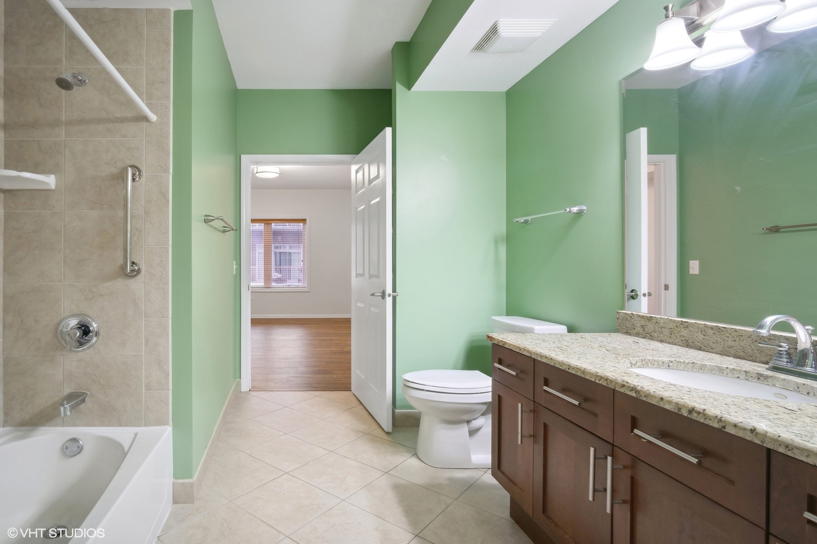 799 Graceland Avenue, Unit 502A Des Plaines, IL 60016 - Photo 28 of 31 a bathroom with a granite countertop sink toilet and shower
