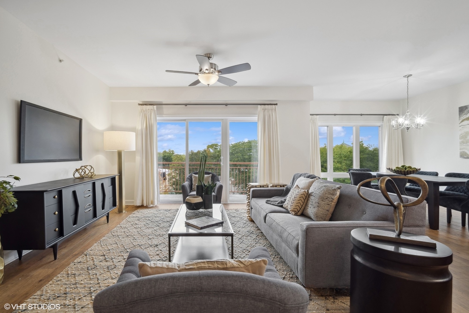 799 Graceland Avenue, Unit 502A Des Plaines, IL 60016 - Photo 7 of 31 a living room with furniture and a flat screen tv
