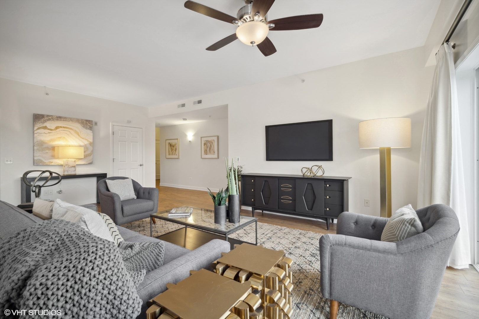 799 Graceland Avenue, Unit 502A Des Plaines, IL 60016 - Photo 9 of 31 a living room with furniture a fireplace and a flat screen tv