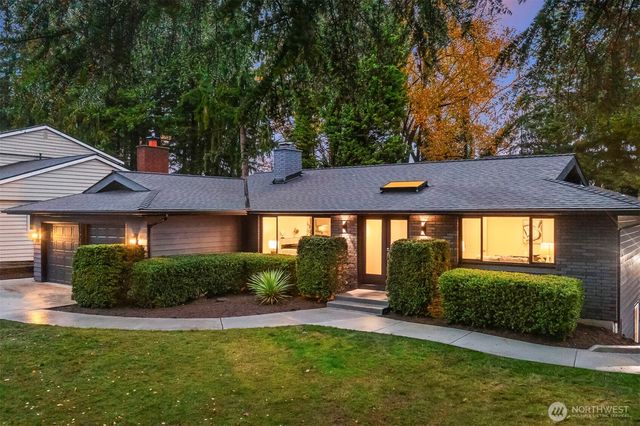 a view of a house with garden and porch