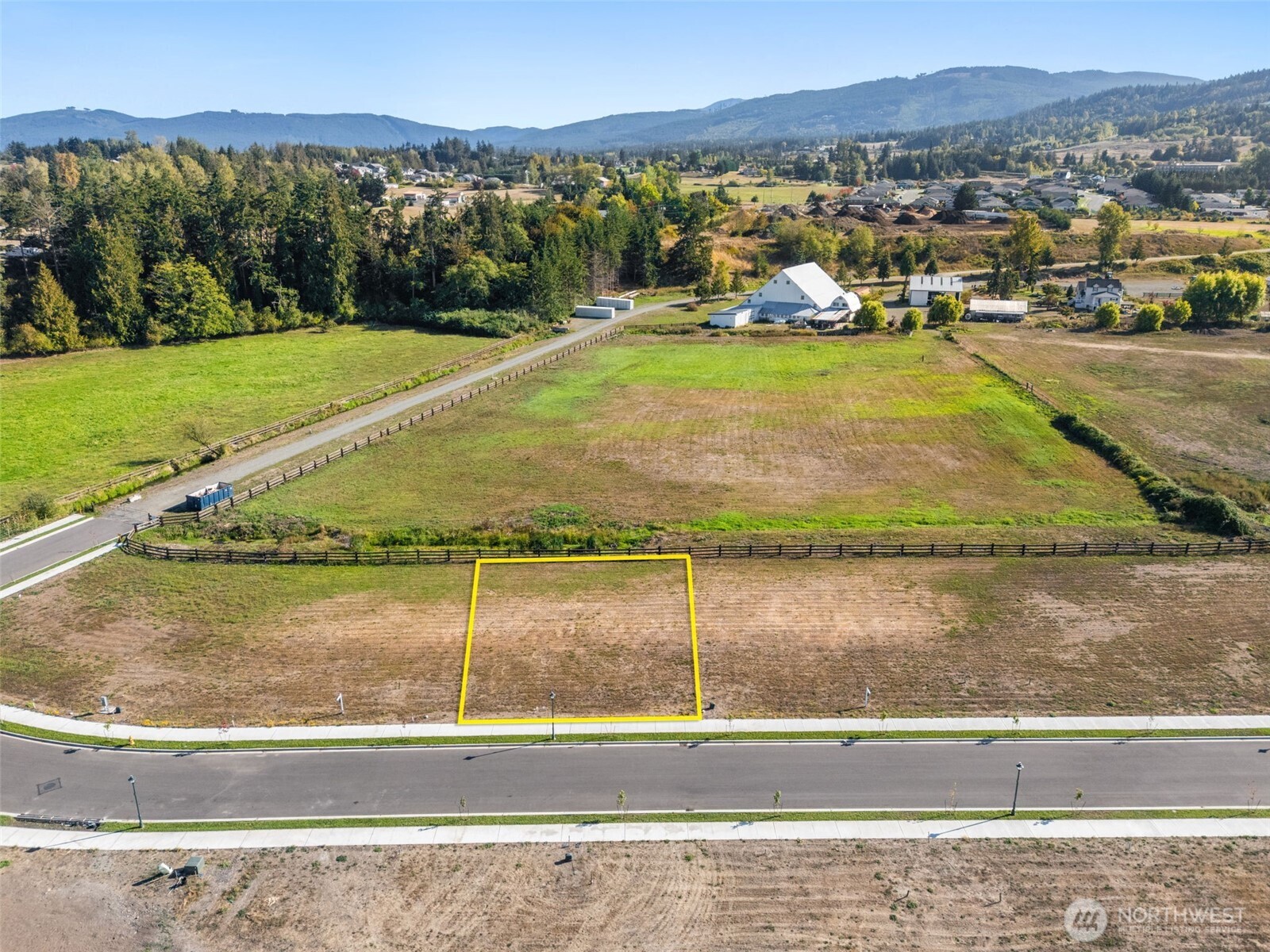130 Dover Lane Sequim, WA 98382 - Photo 2 of 16 a view of a swimming pool with a yard and large tree