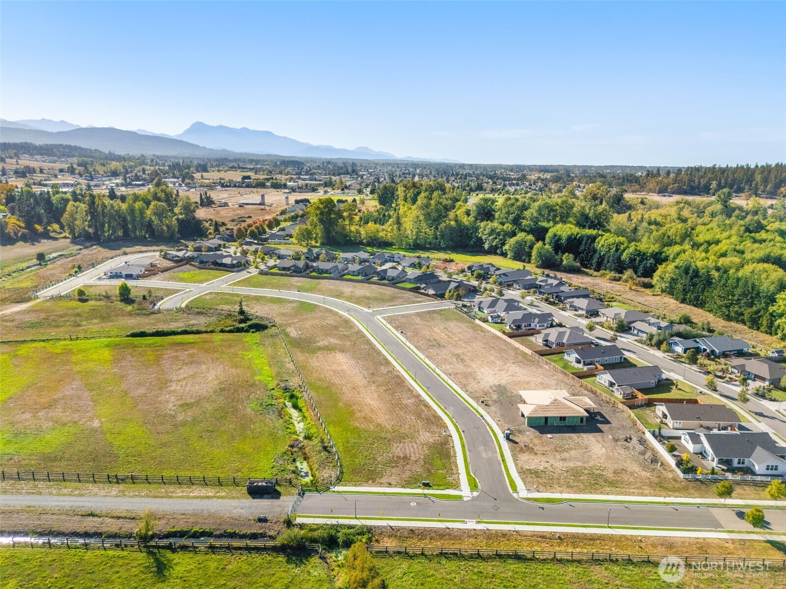 130 Dover Lane Sequim, WA 98382 - Photo 9 of 16 a view of a swimming pool with an ocean view