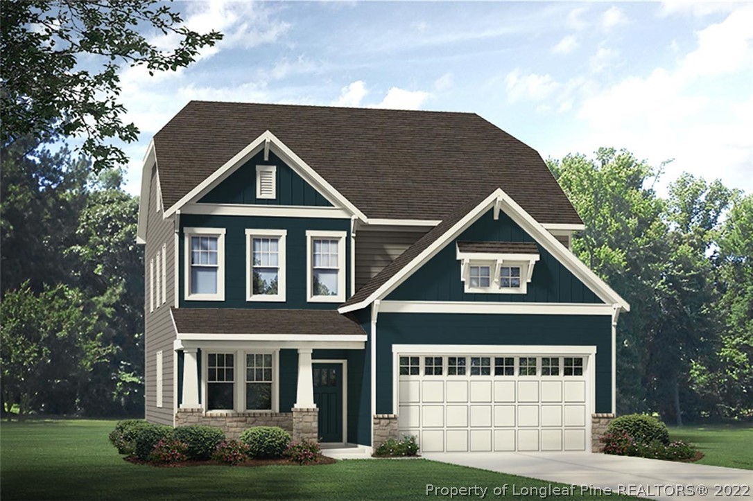428 Kerr Lake Road Aberdeen, NC 28315 - Photo 1 of 10 a front view of a house with garden