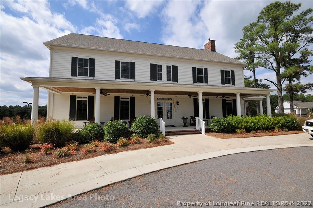 428 Kerr Lake Road Aberdeen, NC 28315 - Photo 4 of 10 a front view of a house with yard and green space