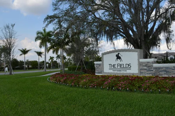 a view of a park that has a sign board