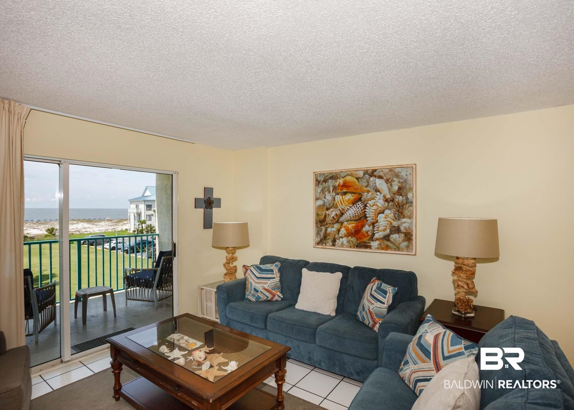645 Plantation Road, Unit 6311 Gulf Shores, AL 36542 - Photo 35 of 43 Living area with light tile patterned floors and a textured ceiling