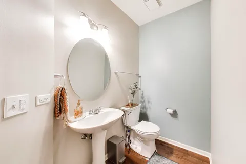 a bathroom with a sink double vanity granite tub and shower