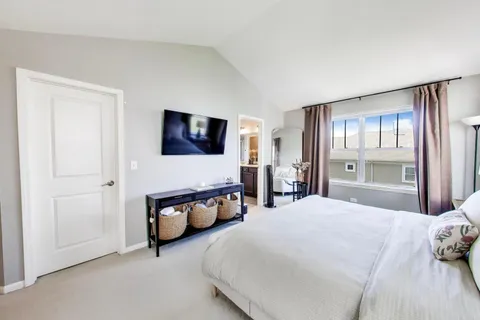 a bedroom with bed and window