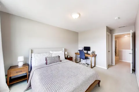 a bed room with furniture and a window